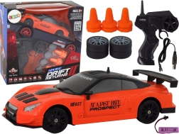 Orange 1:24 RC sports car with interchangeable wheels