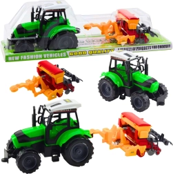 Laste traktor haagisega külvikuga