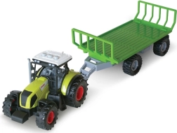 Heliefektidega traktor heinapallide haagisega