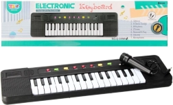Elektrooniline klaver mikrofoniga lastele