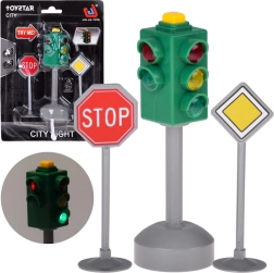 Helendav foorimänguasi heliga ja 2 liiklusmärgiga