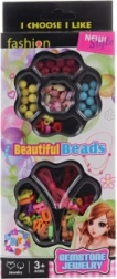Stringing plastic beads and letters in a box