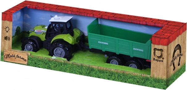 Traktor helide ja tuledega ning rohelise haagisega