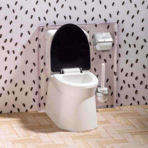 Toilet and accessories like in a real bathroom