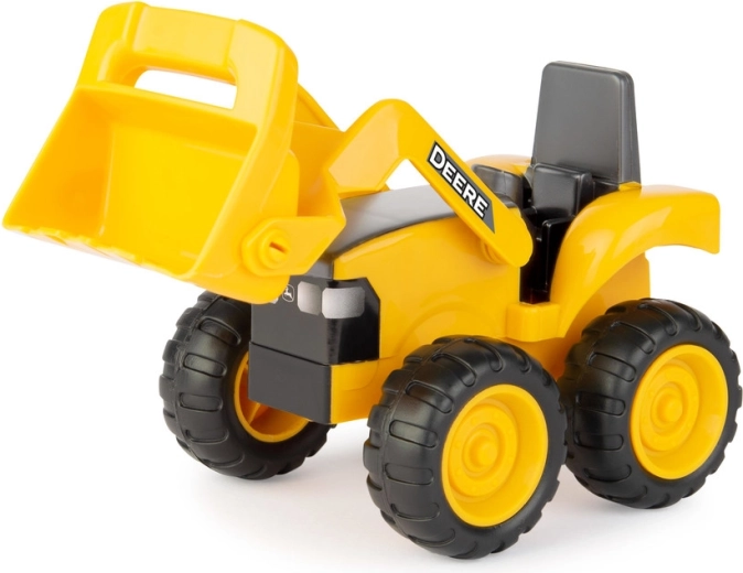 Traktor/laadur materjali kühveldamiseks ja liigutamiseks