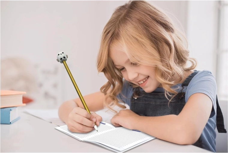Notebook and Golden Snitch pencil