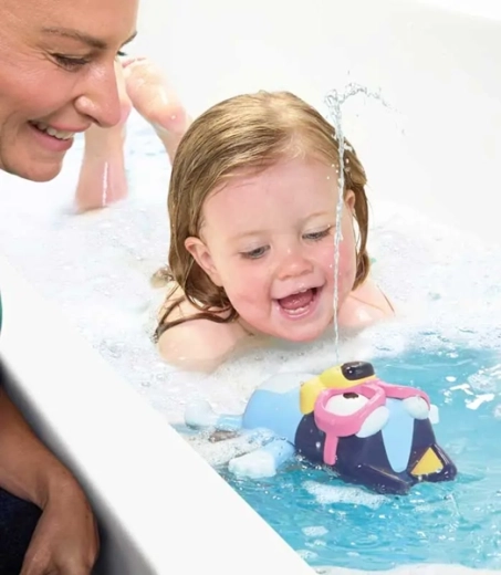 Floating toy with a water fountain