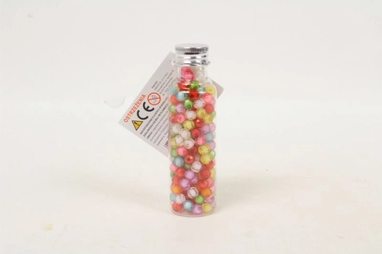 Colorful beads in a mini jar