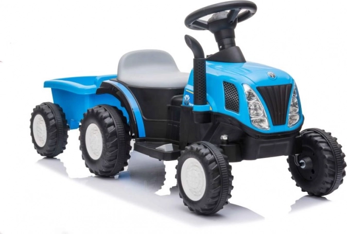 Children’s blue battery-powered tractor with trailer