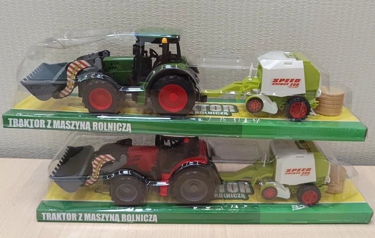 Traktor põllumajandusmasinaga