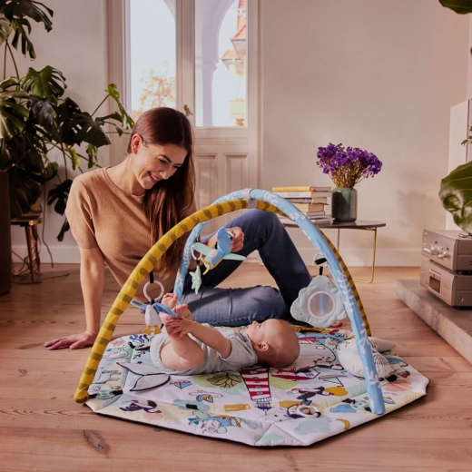 Interactive play arch with toys within reach
