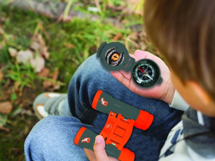 Binoculars and compass for real adventures