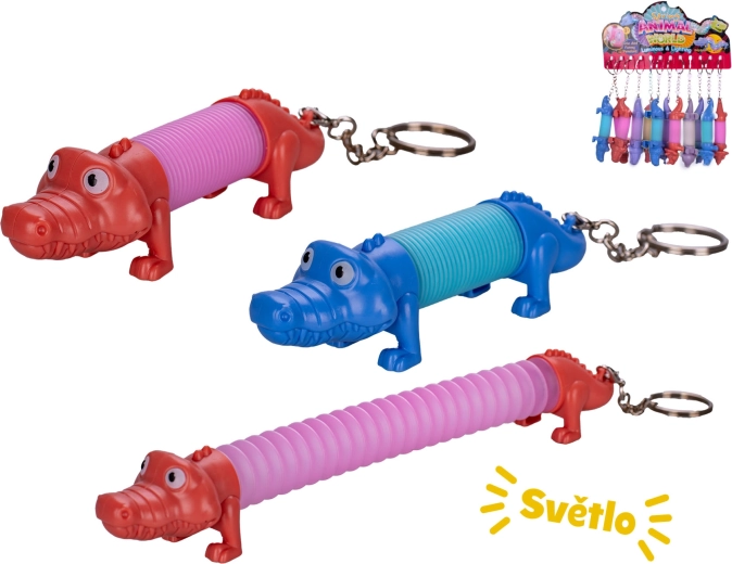 Wind-up crocodile keychain with light