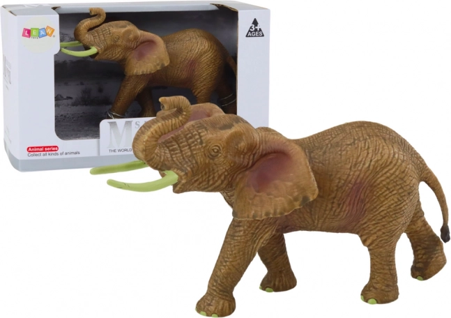 Collectible figure of an African elephant with raised trunk SAFARI