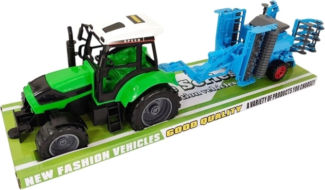 Laste traktor koos lisatava põllumajandusmasinaga