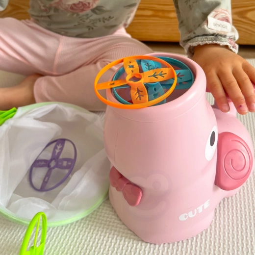 Adorable elephant bubbling with joy for play